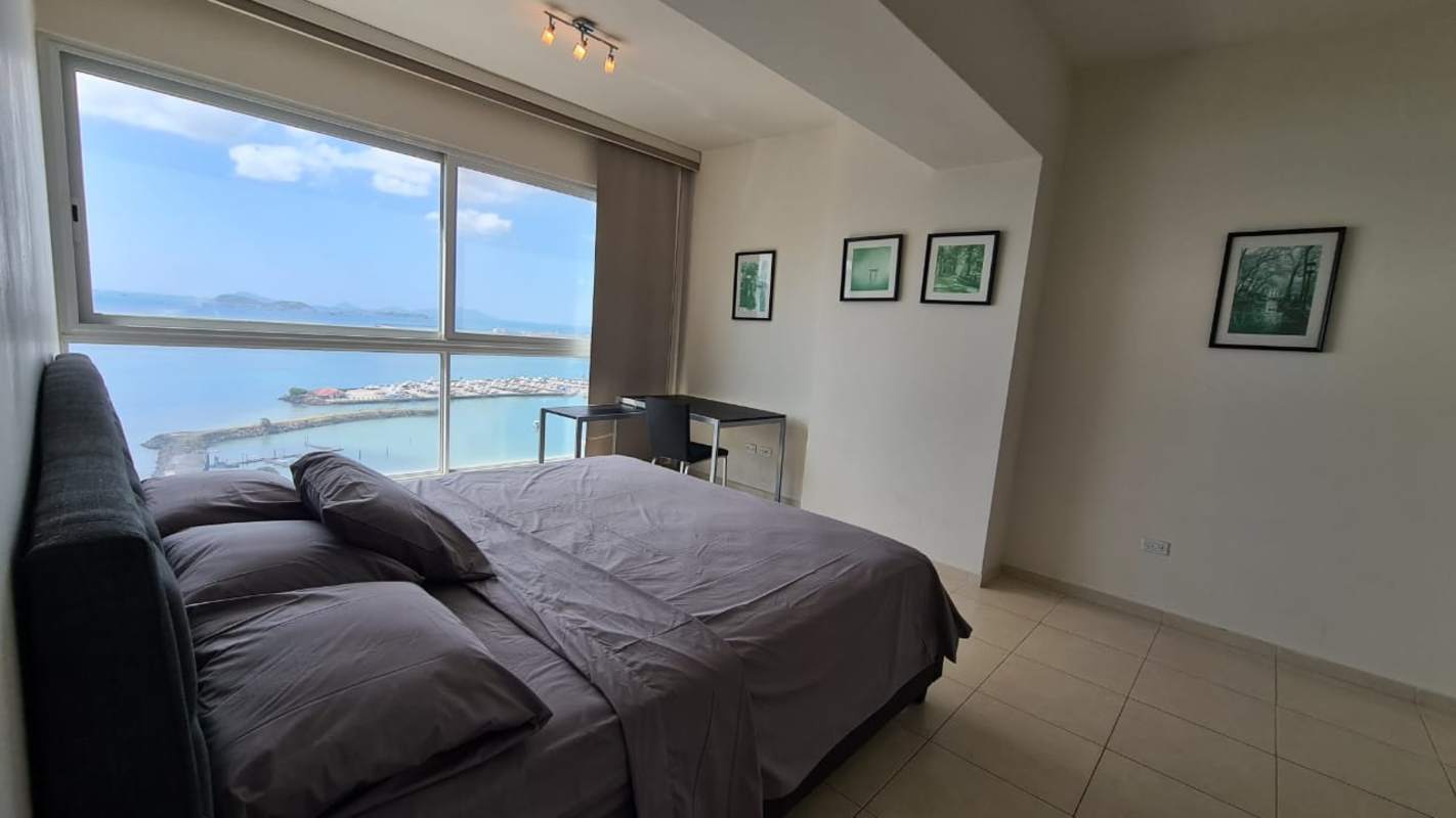 Modern kitchen with granite counters and stainless steel appliances in PH Vista del Mar Panama City