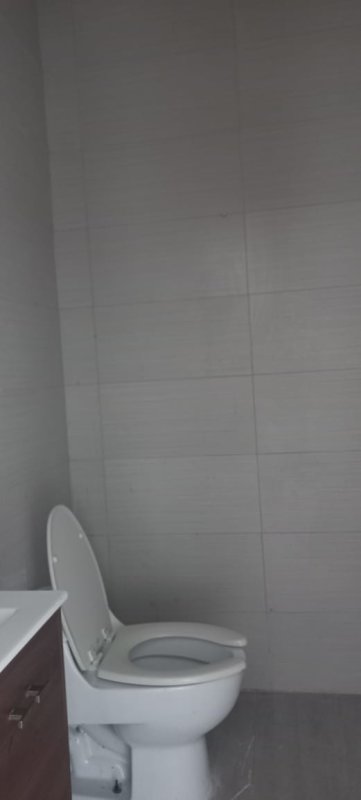 Modern kitchen with granite countertops, subway backsplash and appliances in PH Costamare Costa Sur Panama