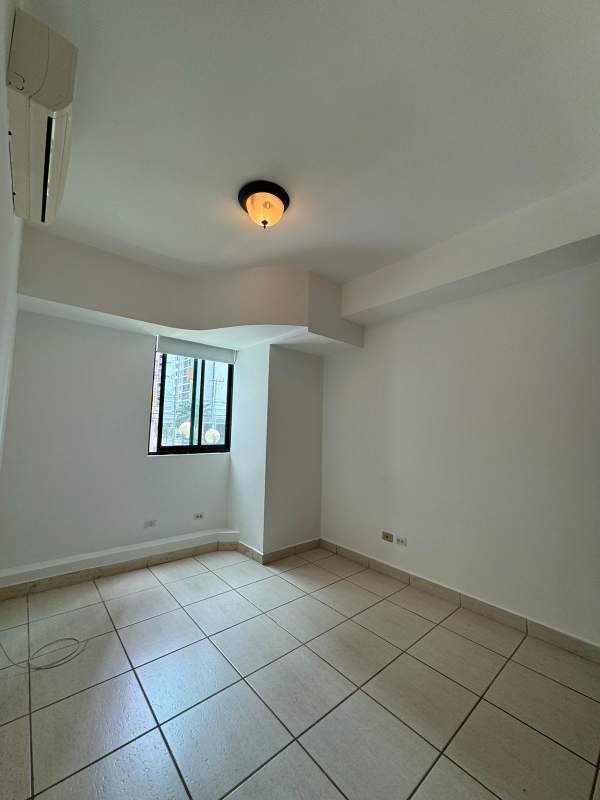 Spacious bedroom with built-in closet, split AC, large window at PH Green Pacific Panama