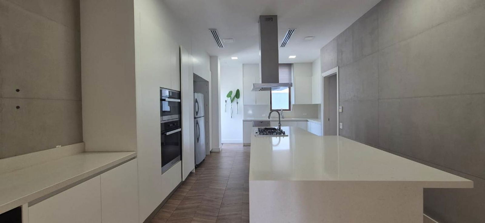 Spacious modern living area with marble floors and large windows at Ocean Reef Islands Panama.