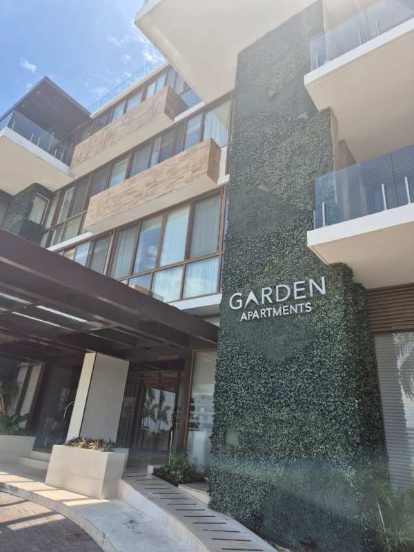 Elegant open space living area with marble floors in Ocean Reef Islands luxury apartment