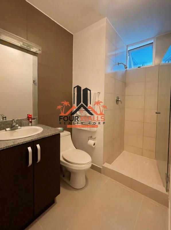Modern bathroom granite countertop, walk-in shower, glass door in PH Waterfalls Panama City