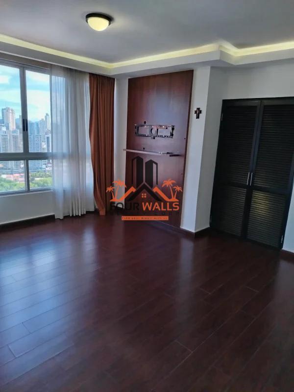 Unfurnished room with city skyline view, closet and large glass window PH Pacific Coast