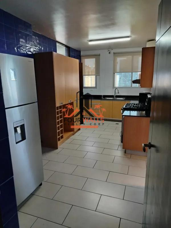 Modern kitchen featuring blue tile backsplash and upper-lower cabinets PH Pacific Coast