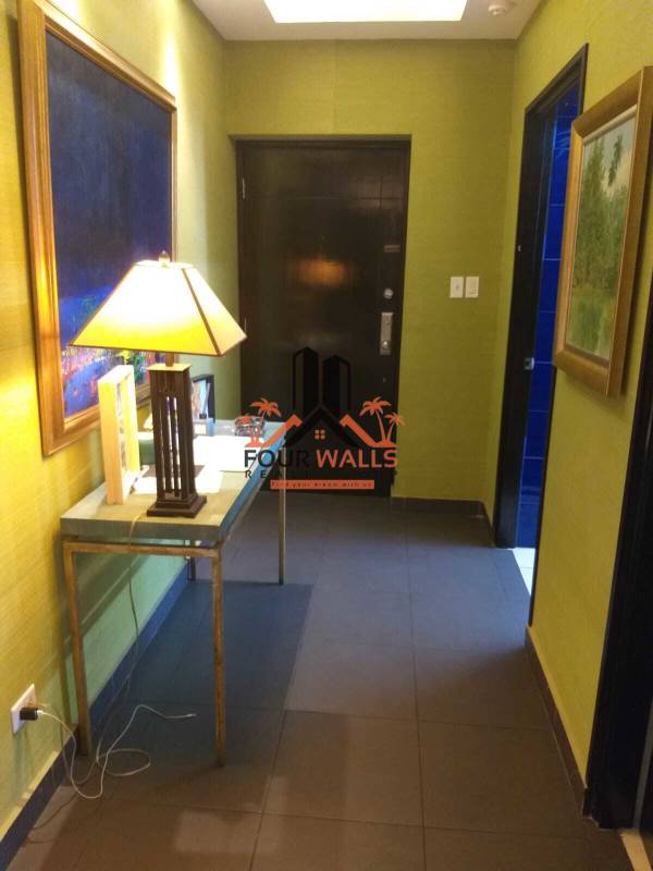 Entrance foyer with accent lighting console table wall art PH Pacific Coast Panama