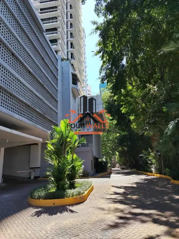 Exterior of modern high-rise PH Pacific Coast with balconies driveway landscaping Panama