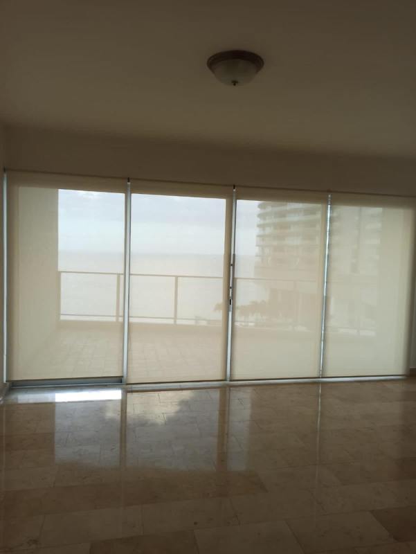 Spacious living dining room with marble flooring and balcony access in Pacific Village Punta Pacifica Panama