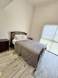 Bright bedroom with large windows and mountain views in PH Mosaic