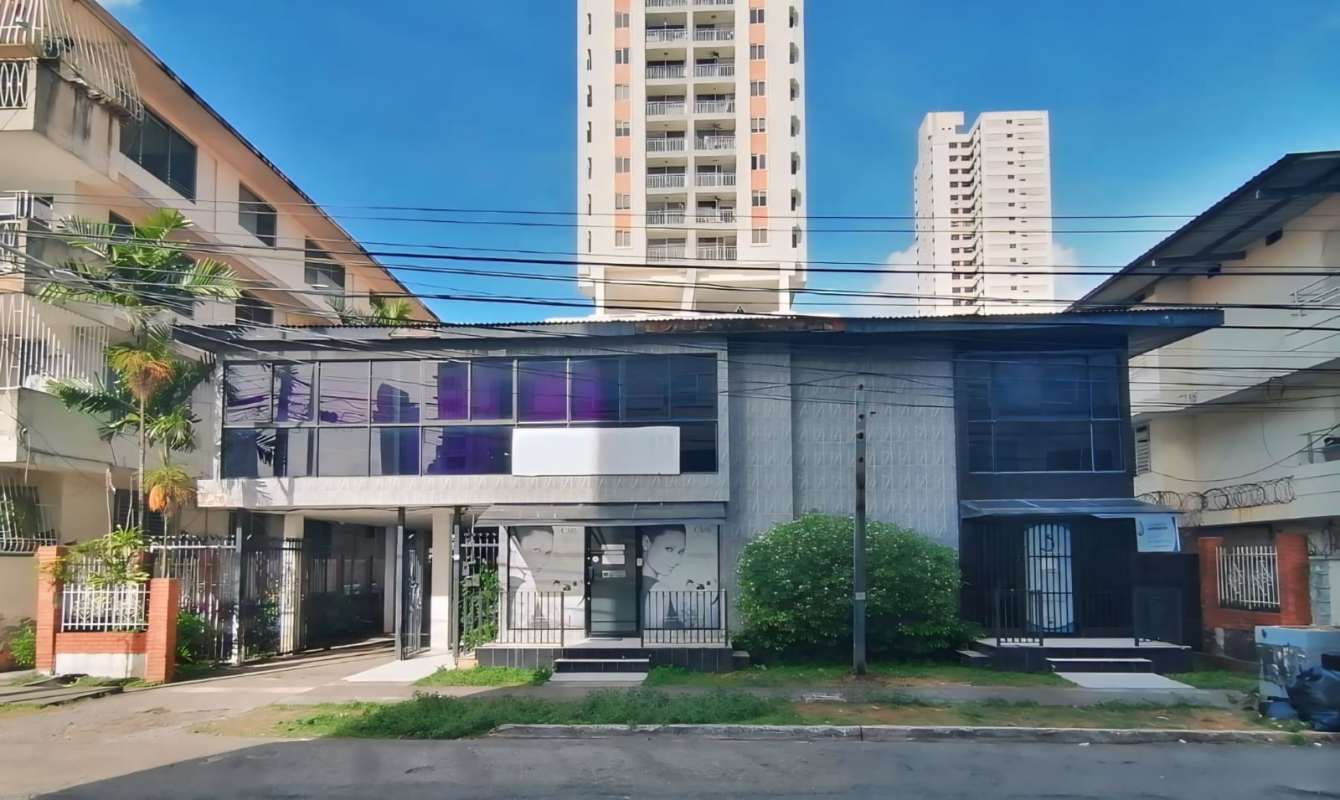 Exterior view of commercial two-story building with large tinted windows Obarrio Panama City