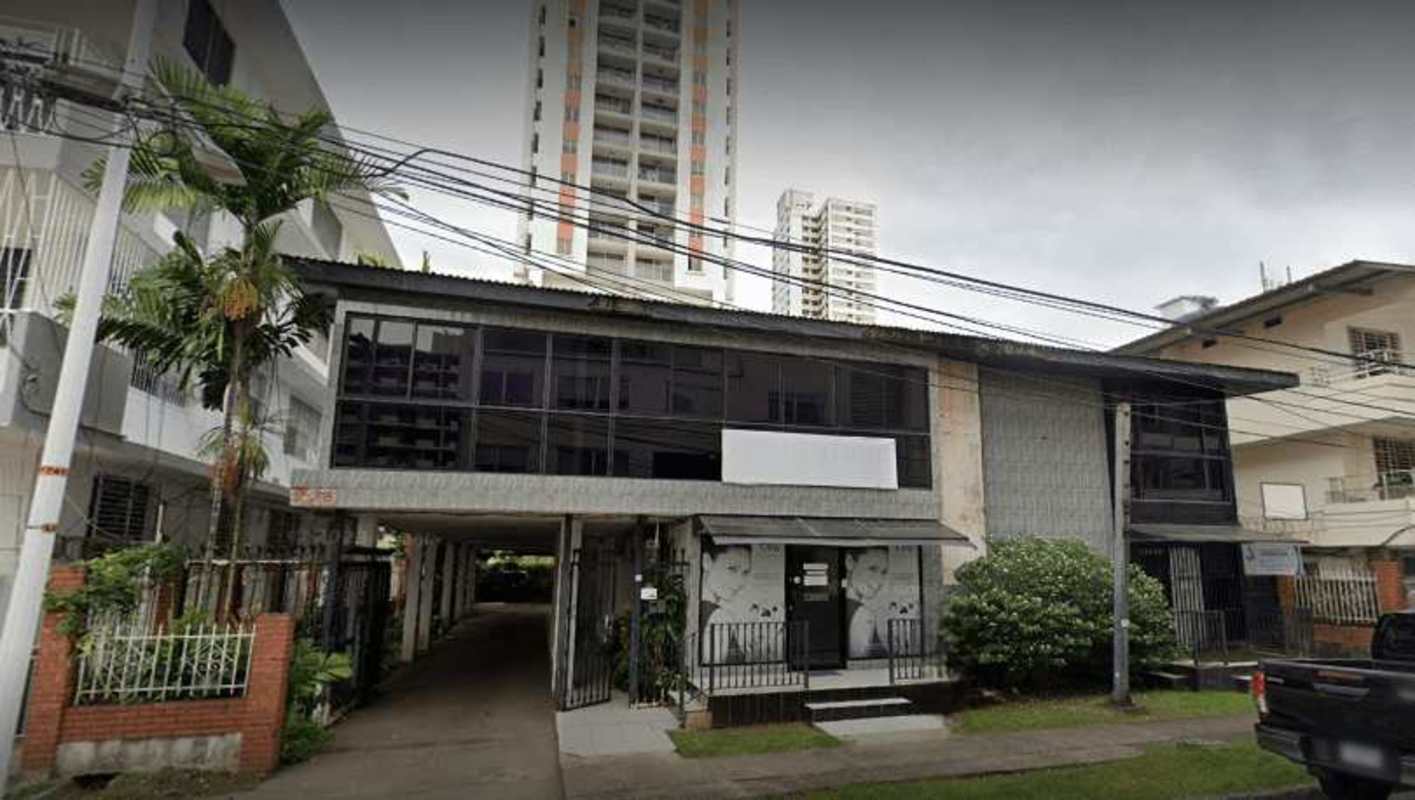 Office conference room with green walls and tile floor in Obarrio