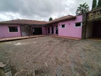 Traditional house facade with paved courtyard and carport country home Bugaba Chiriquí Panama