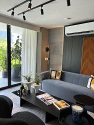 Modern kitchen with quartz surface, ample cabinet space, bright dining area in PH Imaterra Panama Pacifico