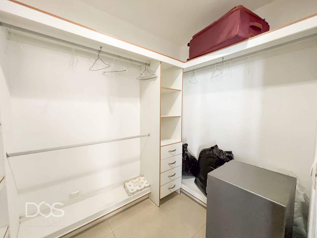 Indoor bar area with marble countertop, bar stools, oceanfront windows in PH Costamare