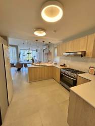 Double height living area with floor-to-ceiling glass windows, modern decor in PH Imaterra Panama Pacifico