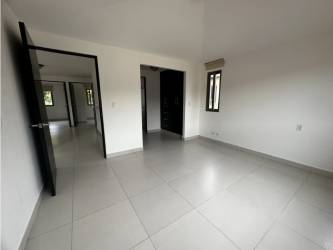 Large bedroom with white tile floors in single-family house Panama
