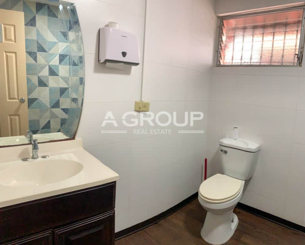 Interior private office room with glass walls, wood floors for rent in Panama commercial property