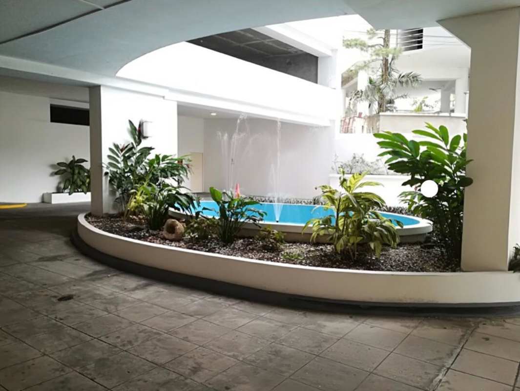 Outdoor swimming pool and jacuzzi atop PH Mont Royale with panoramic city and mountain backdrop Panama