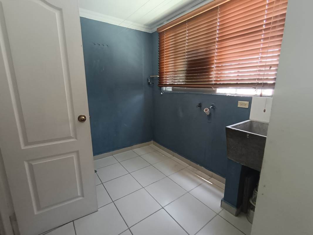 Kitchen with granite countertops, tile walls, wood cabinets PH Mikonos Chanis Panama
