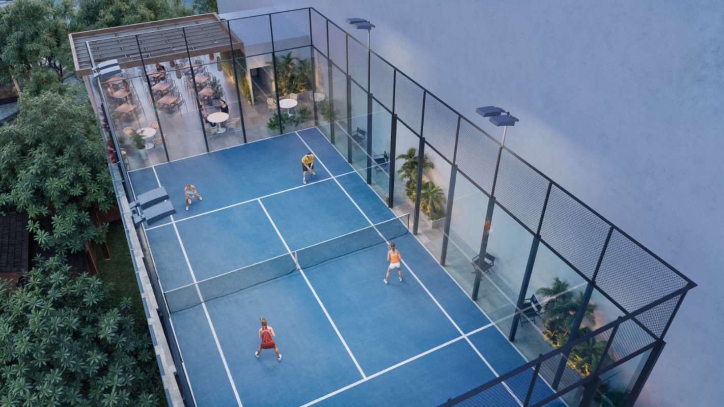 Rooftop paddle tennis court next to outdoor dining gardens in PH Costanera Panama