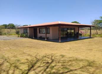 Single story house villa porch tiled roof yard Pedasi beach community Panama