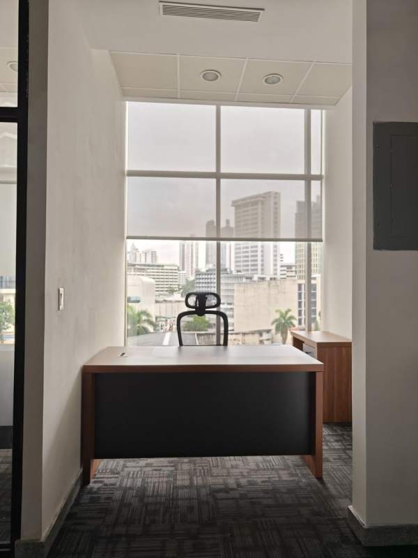 Spacious furnished office with floor-to-ceiling windows and city skyline view PH Habitats Plaza Panama City