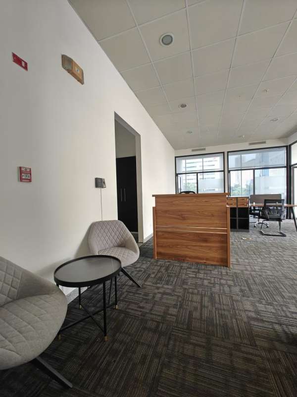 Corporate furnished reception area with modern décor at PH Habitats Plaza Calle 50 Panama City