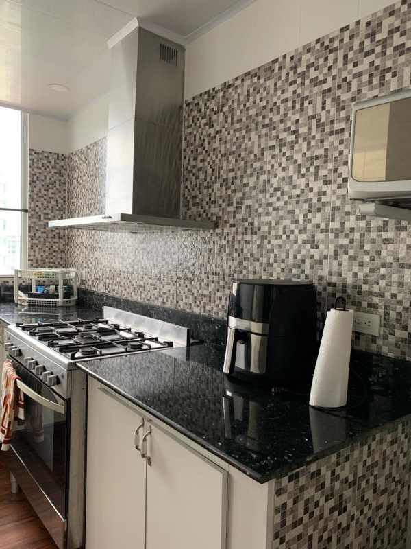 Kitchen featuring stainless appliances, black granite counters, mosaic backsplash PH El Cangrejo Plaza Panama