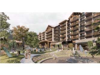 Modern alpine-style residential complex Town Boquete with balconies, landscaped courtyard, and playground