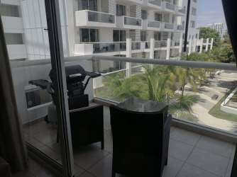 Balcony seating area overlooking Playa Blanca Resort lagoon and gardens