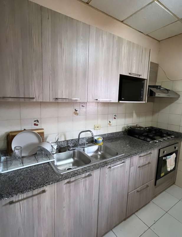 Spacious living dining area with ceiling fan, large windows, natural light in Villa Zaita Panama