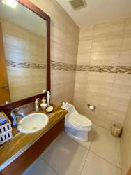 Bright guest bedroom with large windows garden views air conditioning in Altamar Casamar Panama