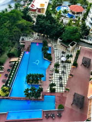 Aerial of infinity pools and deck PH Bahia facing Pacific Ocean Gorgona Panama