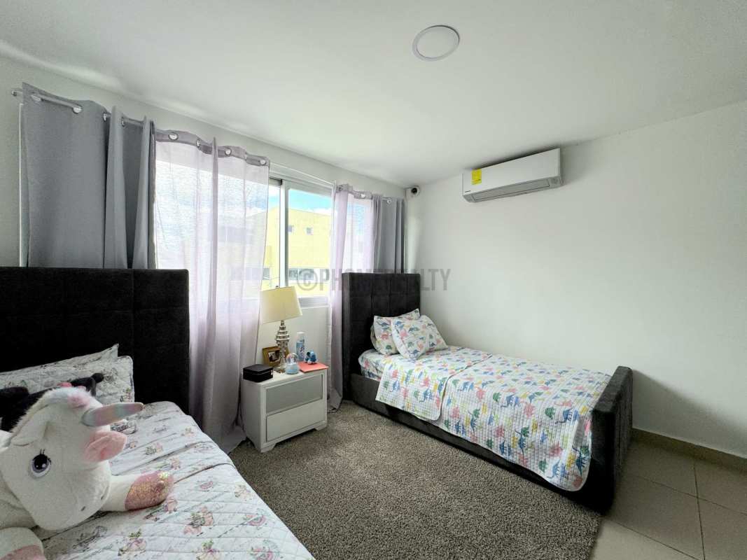 Kids room with two beds, air conditioning, large window Costa Sur Village Panama