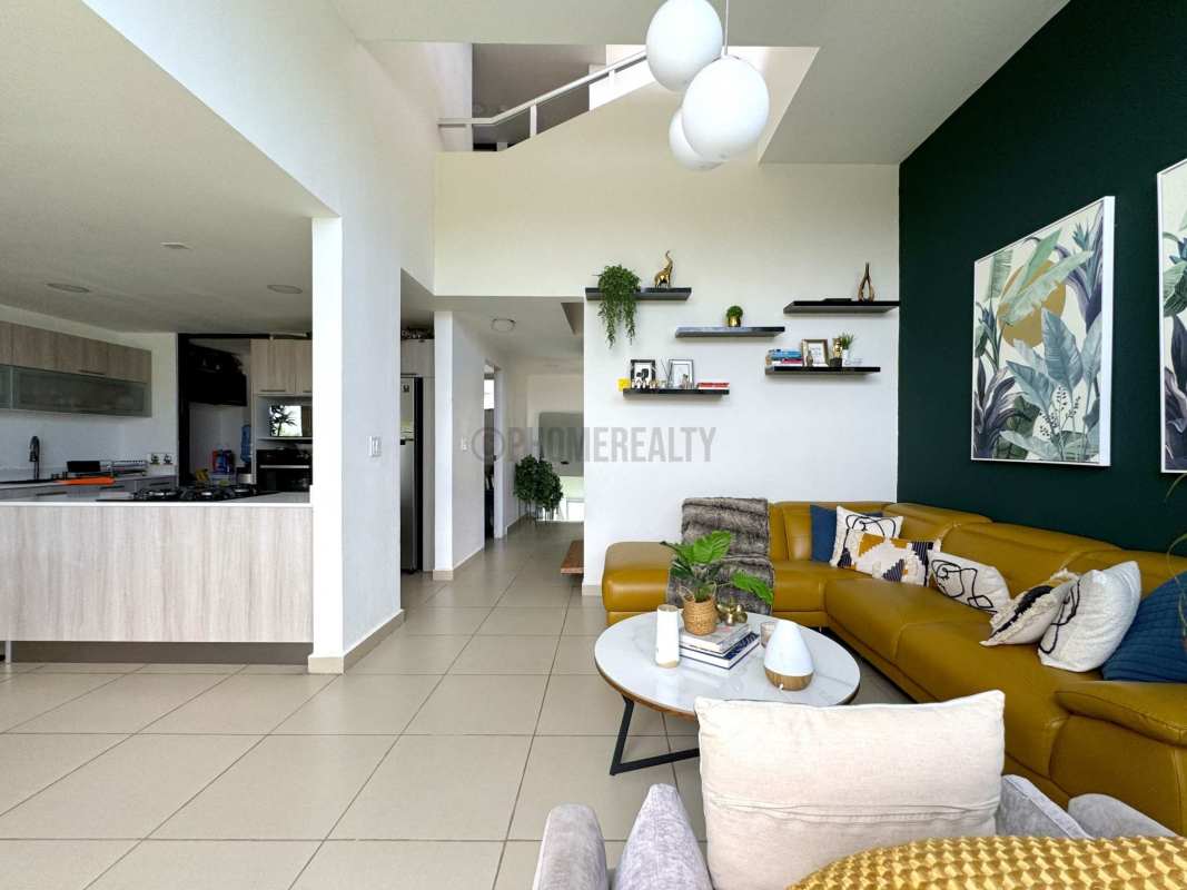 Interior staircase with wood steps and bright windows Costa Sur Village Panama