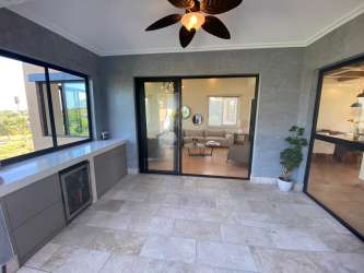 Fully equipped open kitchen with granite counters at luxury penthouse Buenaventura Panama