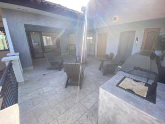 Open concept living and dining room with marble floors in penthouse Bristol Residences Buenaventura Panama