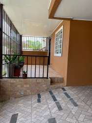Large rear terrace with bar counter, tiled floor in gated La Arboleda community La Chorrera Panama