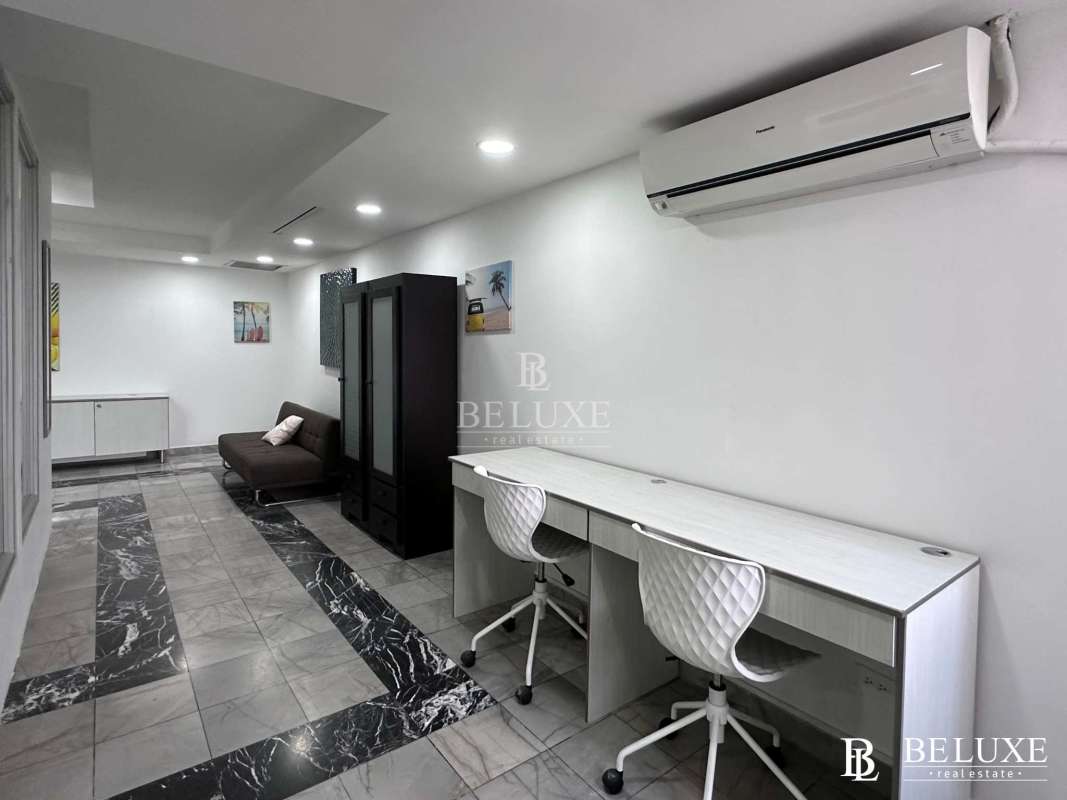 Workspace with large windows vertical blinds marble floors in Torre BAC Panama