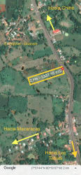 Vacant land with red borders marked on aerial image Guararé Los Santos on main regional route