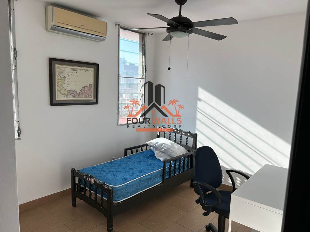 Compact office area with built-in storage at PH Mediterráneo Panama