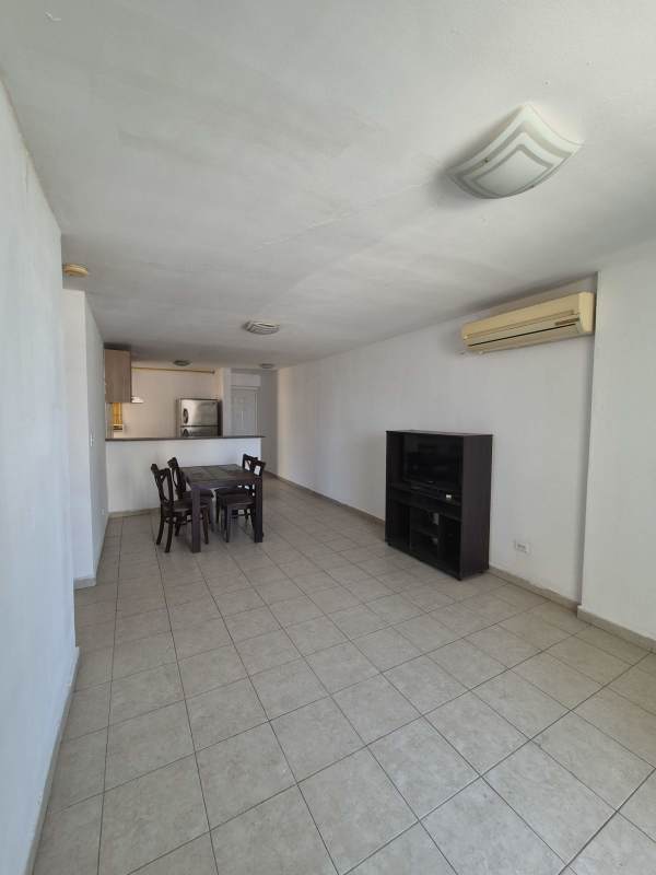 Dining area integrated with living room open plan layout apartment PH Avenida Balboa Panama City