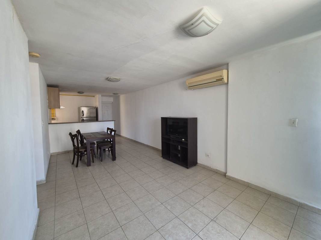 Kitchen with granite tops, wood cabinets, ceramic tile floors in PH Avenida Balboa Residences Panama City
