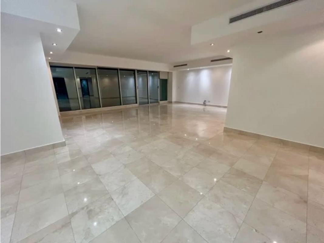 Open living room with marble floors and large ocean-view windows at PH Ocean Two Costa del Este Panama