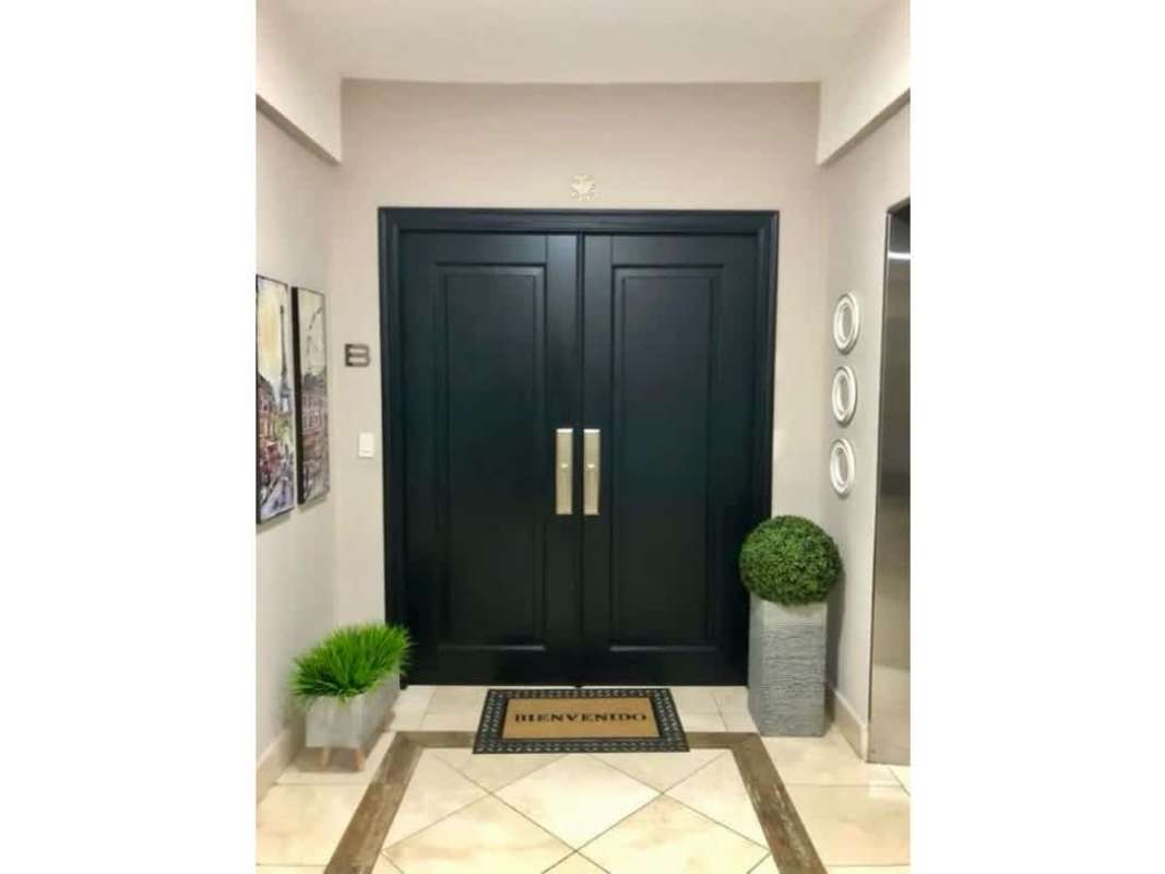 Double black doors, modern lobby design at PH Ocean Two Costa del Este Panama