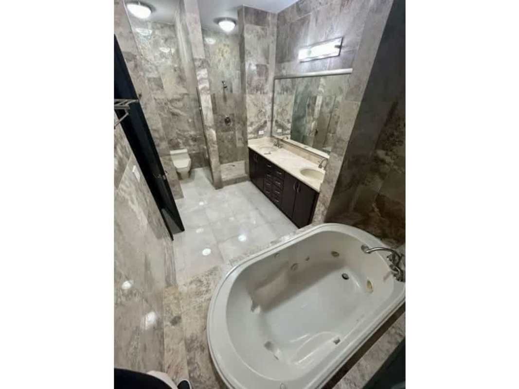 Marble bathroom with jacuzzi bathtub double sinks separate toilet PH Ocean Two Costa del Este Panama
