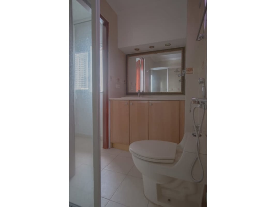Bathroom with glass-enclosed shower, vanity, neutral tiles PH Brisas del Carmen Bella Vista Panama