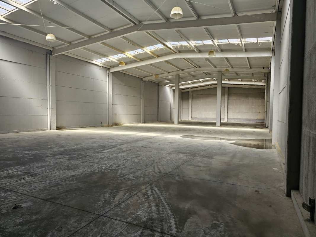 Empty commercial space tiled floor glass table drop ceiling in Pacora Panama warehouse