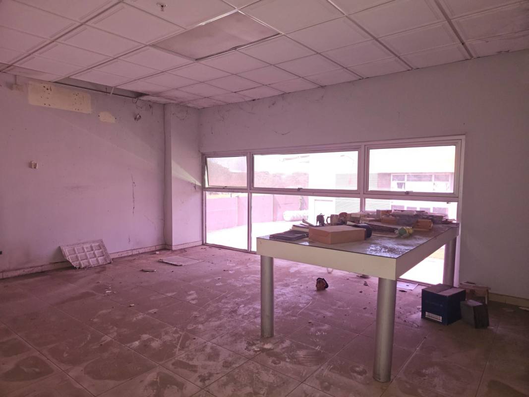 Commercial warehouse interior with tiled floor metal stairs open ceiling Pacora Panama