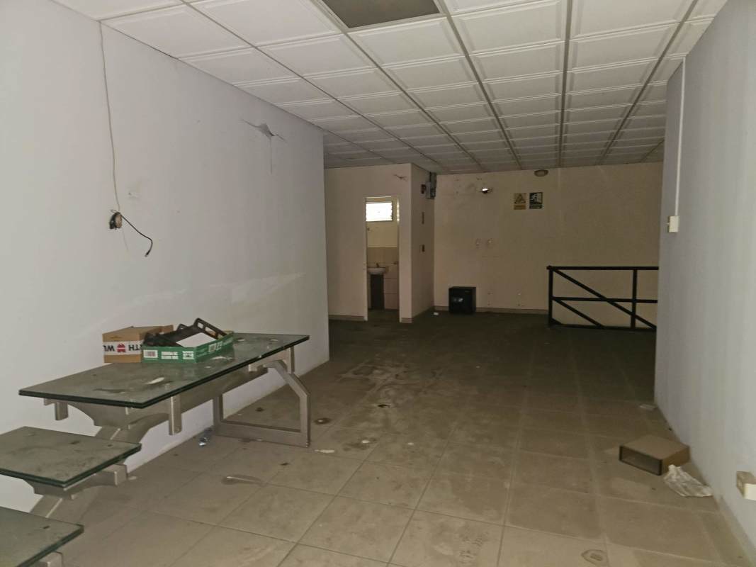 Empty warehouse interior with concrete floor skylights and high ceilings in Pacora Panama