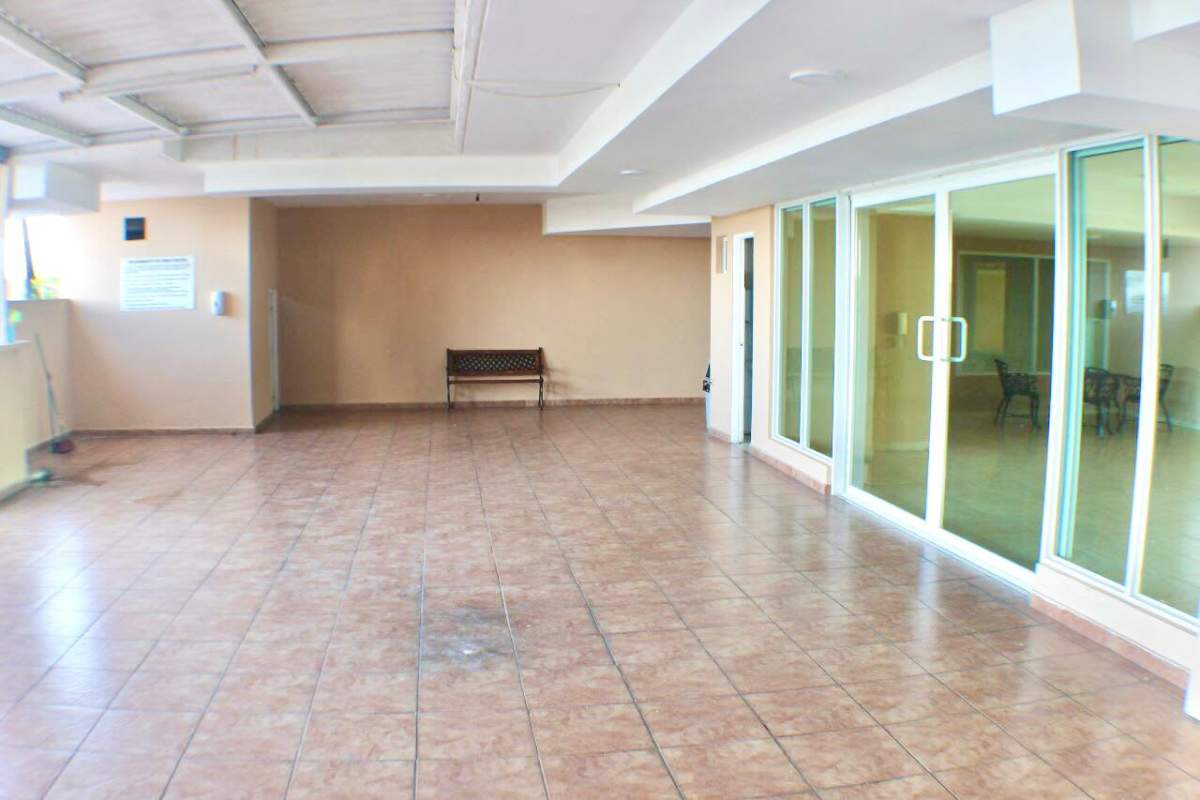 Common area with tile floor, sliding glass doors and natural light PH Villa de las Fuentes Panama